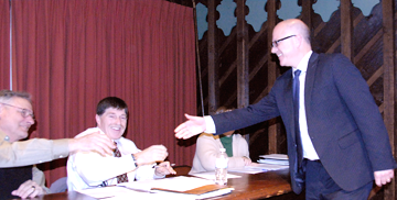 Steve Kawa from the Mayor's Office greets officers